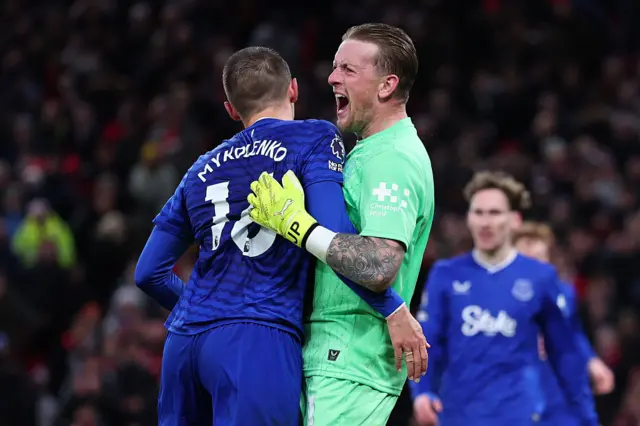 Jordan Pickford of Everton celebrates with Vitaliy Mykolenko