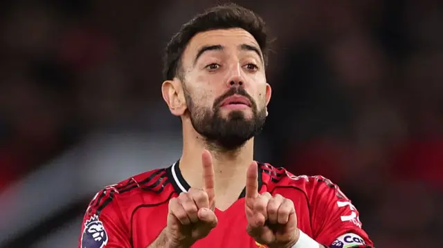 Bruno Fernandes talks to his team-mates