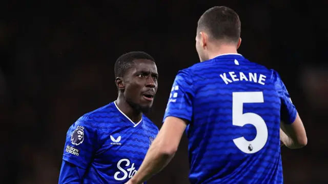 Idrissa Gueye of Everton clashes with teammate Michael Keane