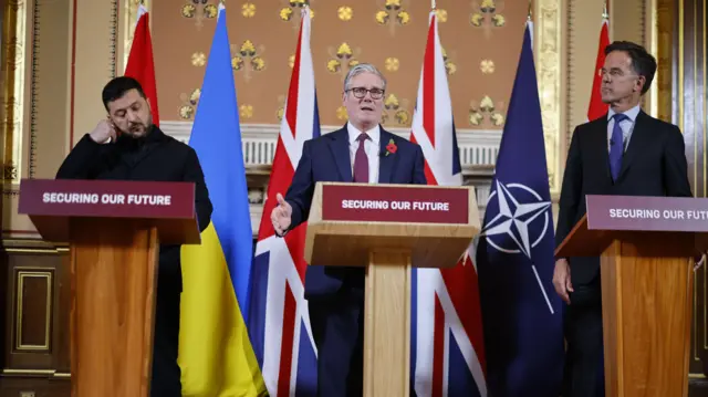 Ukraine's President Volodymyr Zelensky, British Prime Minister Keir Starmer and NATO Secretary General Mark Rutte speak to the media following the 'Coalition of the Willing ' meeting in London, Britain, 24 October 2025.