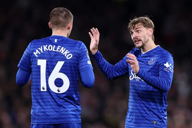 Kiernan Dewsbury-Hall of Everton (R) speaks to team mate Vitaliy Mykolenko (L)