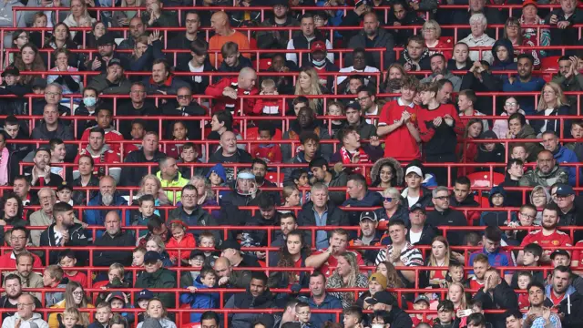 Manchester United fans watch from new rail seating in 2021