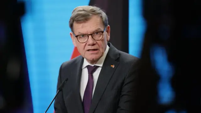 Wadephul speaking into mic