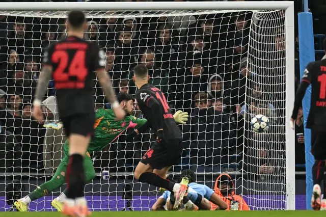 Bayer Leverkusen forward Patrik Schick (C) scores