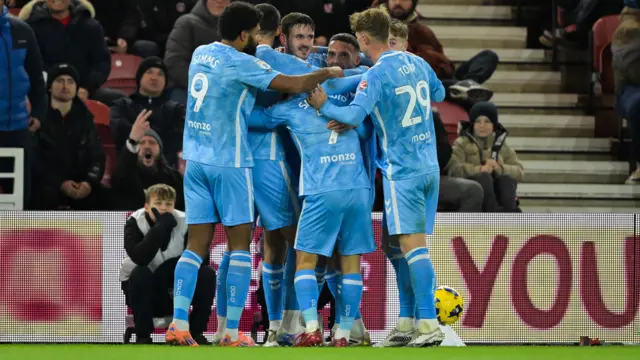 Coventry players celebrate with Liam Kitching