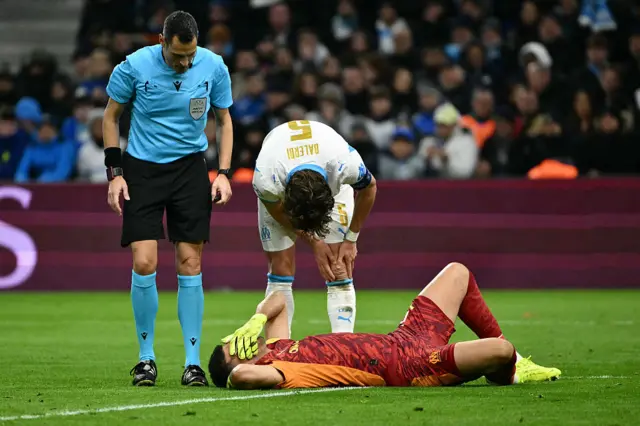 Geronimo Rulli (down) is checked on after an injury