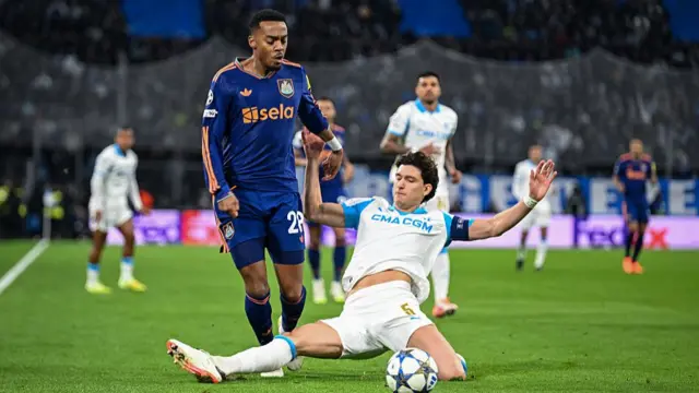 Leonardo Balerdi slides in to tackle Joe Willock