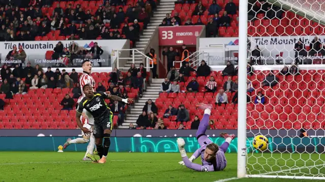 Thomas Kaminski watches as Sorba Thomas' cross/shot nestles into the far corner
