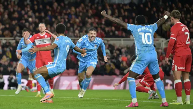 Coventry players celebrate Liam Kitching's goal