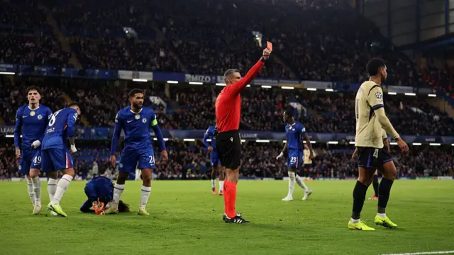 Ronald Araujo of Barcelona is shown a red card