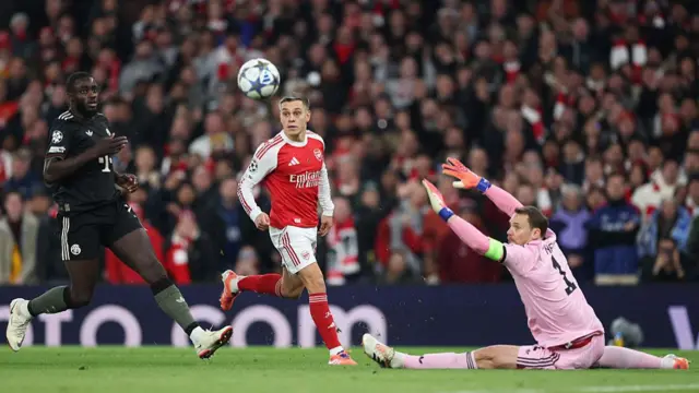 Dayot Upamecano and Manuel Neuer of Bayern Munich look on as Leandro Trossard shoots wide