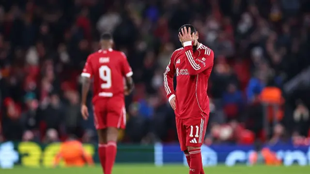 A dejected Mohamed Salah puts his head in his hand