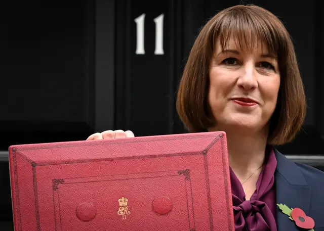 Chancellor Rachel Reeves holds up the red Budget Box outside No. 11 Downing Street.
