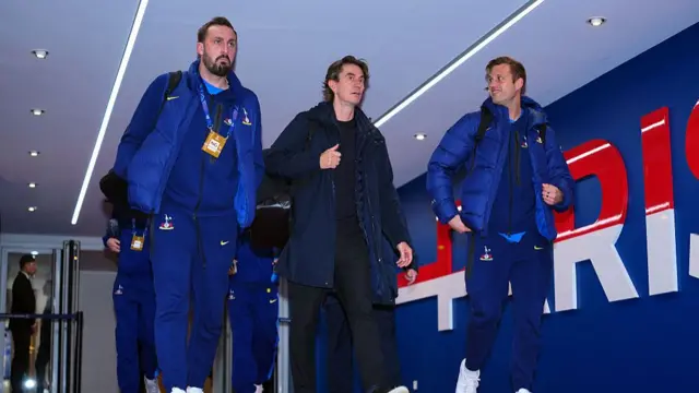 Tottenham manager Thomas Frank (2l) arrives at the stadium