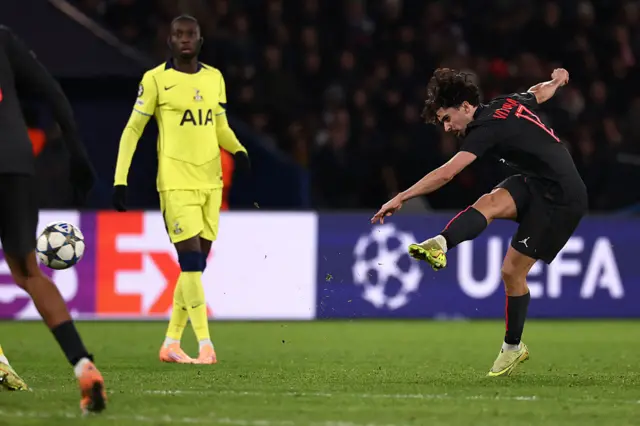 Vitinha (R) shoots to score