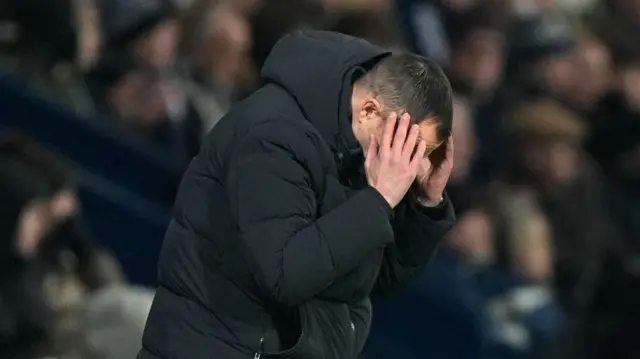 Chris Davies with head in hands