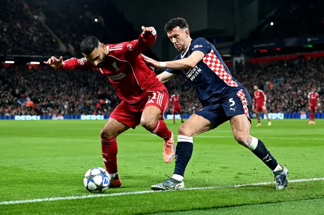 Mohamed Salah of Liverpool is challenged by Ivan Perisic of PSV Eindhoven