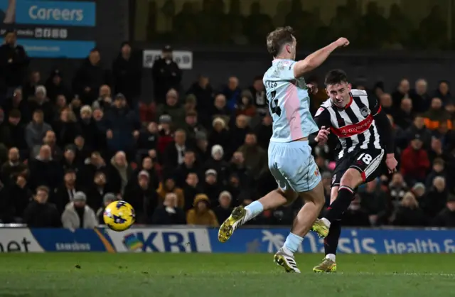 Darragh Burns of Grimsby Town scores