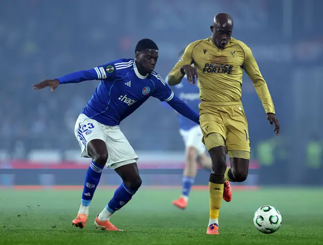 ean-Philippe Mateta is challenged by Mamadou Sarr