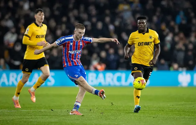 Wharton plays a pass v Wolves
