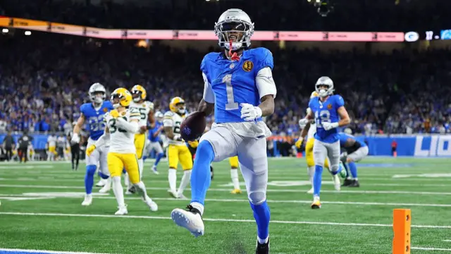 Jameson Williams of the Detroit Lions scores a touchdown against the Green Bay Packers