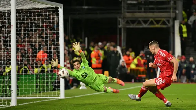 Nikola Milenkovic scores his team's third goal