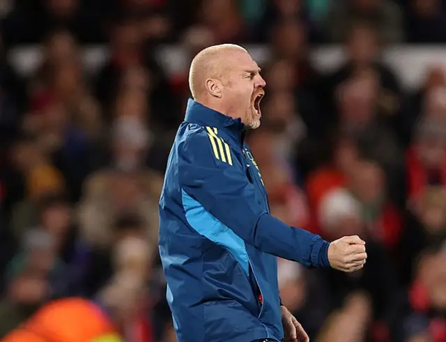 Sean Dyche roars and punches the air in celebration