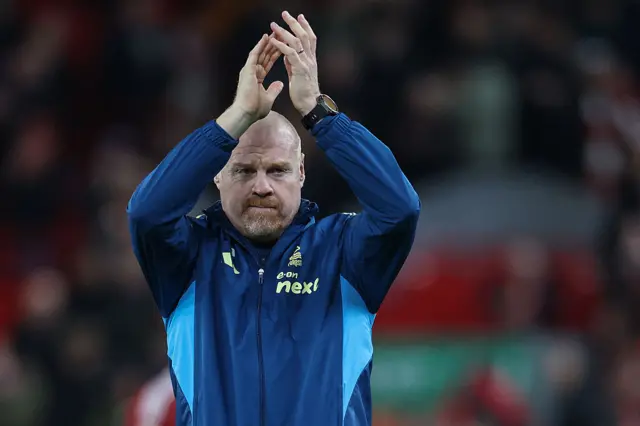 Sean Dyche clapping with his hands in the air