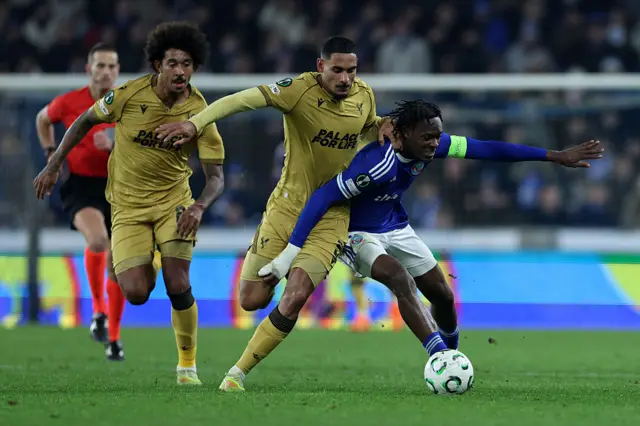 Emanuel Emegha of Strasbourg is challenged by Maxence Lacroix