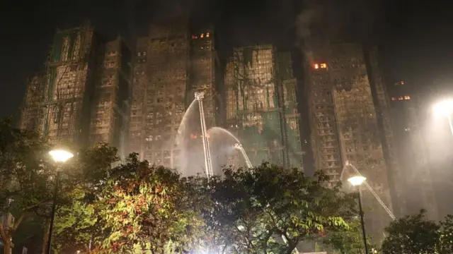 Several apartments remain on fire and rescue efforts continue at the Wang Fuk Court residential buildings, in Tai Po, Hong Kong, on 27 November 2025.