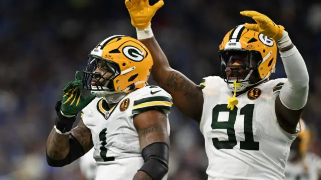 Green Bay Packers defensive end Micah Parsons and defensive tackle Warren Brinson celebrate against the Detroit Lions