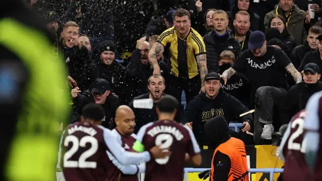 Young Boys fans throw cups