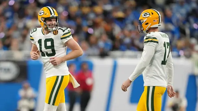 Dan Whelan smiles after Brandon McManus kicks a field goal for Green Bay against Detroit