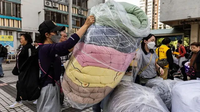 Clothes and bedding are collected near residential buildings
