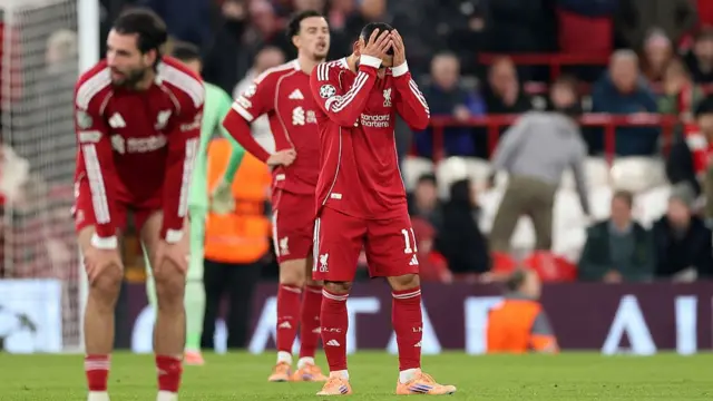 Mohamed Salah puts his head in his hands during Liverpool's game against PSV.
