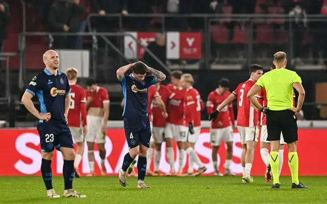 Shellbourne players trudge back to kick off after conceding