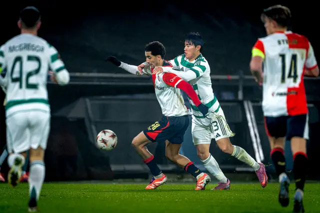 Celtic players try to regain the ball