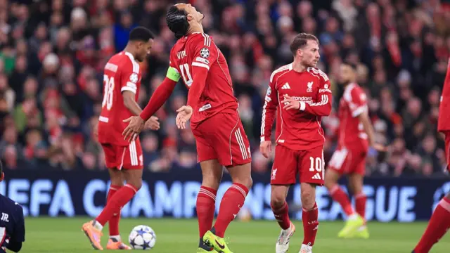Liverpool's Virgil van Dijk looks up to the sky in frustration during the game against PSV.