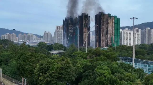 A drone view shows flames and thick smoke rising from Wang Fuk Court housing estate during a major fire, in Tai Po, Hong Kong