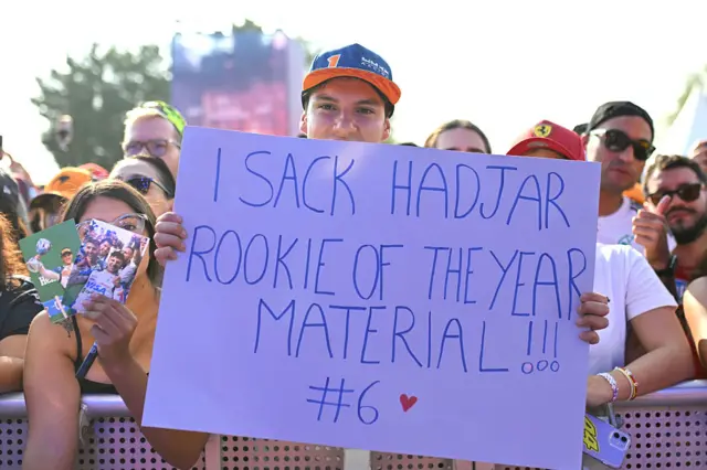 Fans hold up sings for Isack Hadjar