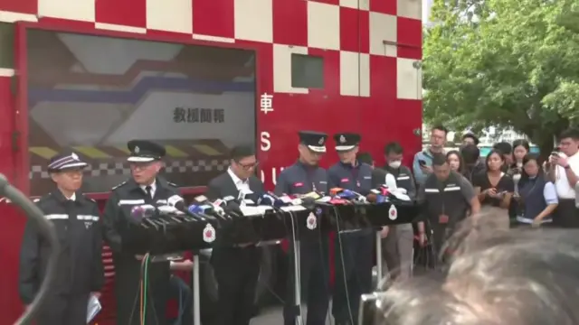 Officials lined up about to give a news conference