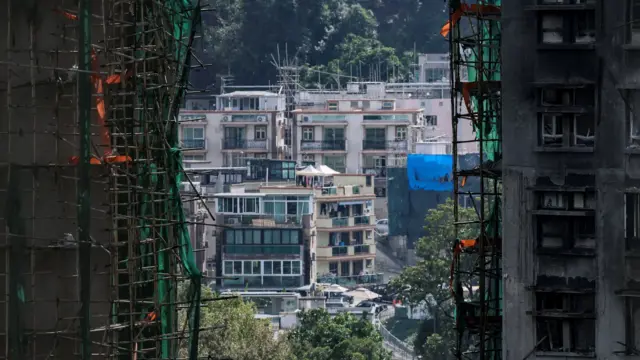 A shot of still intact building frames between two of the burnt out towers