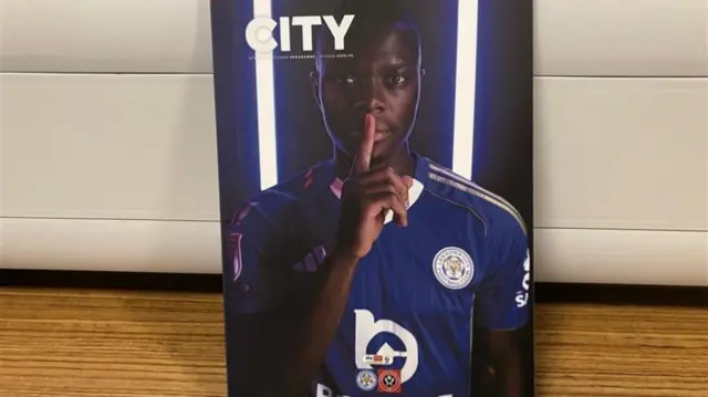 The front page of the Leicester matchday programme with Patson Daka putting his finger to his lips