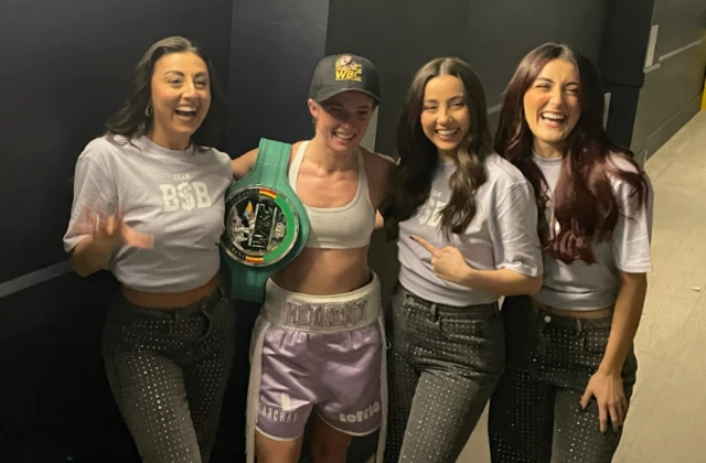 Francesca Hennessy celebrates with a belt around her waist