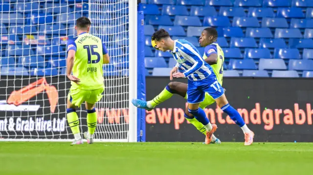 Charlie McNeill heads Sheffield Wednesday's second goal