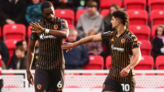Semi Ajayi celebrates with Hull team-mate Mohamed Belloumi