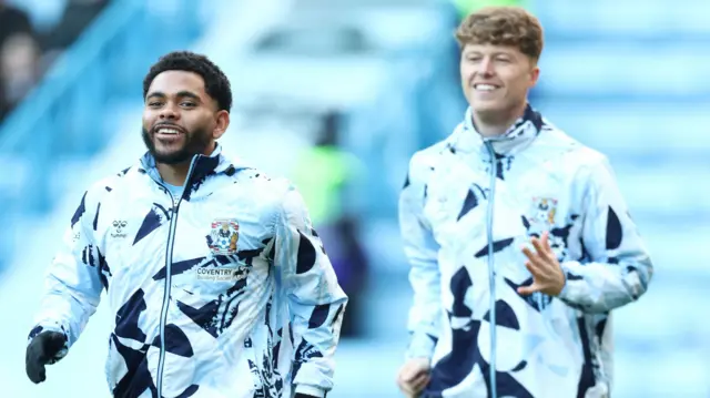Coventry's Jay Dasilva and Victor Torp warm up