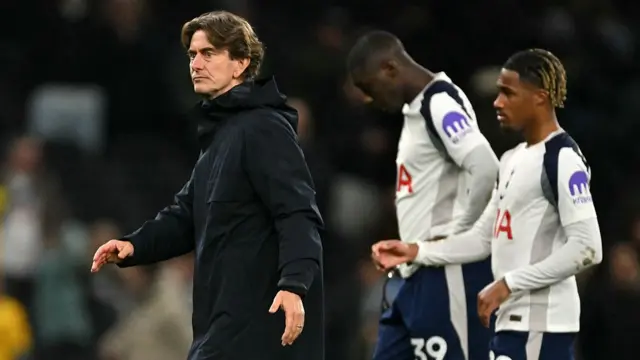Thomas Frank walks off the pitch with his players