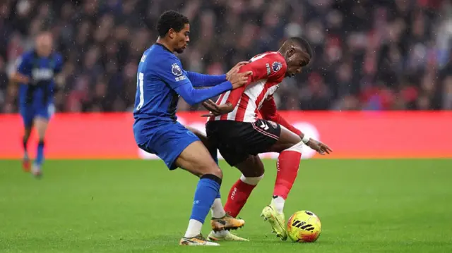 Nordi Mukiele of Sunderland is challenged by Amine Adli of Bournemouth