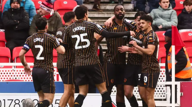 Hull players celebrate with Semi Ajayi